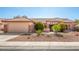 Inviting single story home with a well maintained yard and attached two car garage at 16331 W Willow Creek Ln, Surprise, AZ 85374