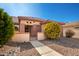 Charming gated entryway leading to the front door of this single story home at 16331 W Willow Creek Ln, Surprise, AZ 85374