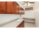 Laundry room with ample cabinetry and countertop space at 16331 W Willow Creek Ln, Surprise, AZ 85374