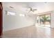 Large living room featuring tile flooring and sliding glass doors at 16331 W Willow Creek Ln, Surprise, AZ 85374