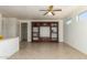 Living room featuring built-in shelving and tile flooring at 16331 W Willow Creek Ln, Surprise, AZ 85374