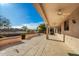 Covered patio with ceiling fans and views at 16331 W Willow Creek Ln, Surprise, AZ 85374