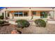 Covered patio featuring two ceiling fans, a concrete surface, and desert landscaping at 16331 W Willow Creek Ln, Surprise, AZ 85374