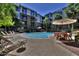 Relaxing pool area with lounge chairs and tables at 1701 E Colter St # 421, Phoenix, AZ 85016