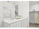 Modern bathroom with double vanity and walk-in shower at 17735 W Mission Ln, Waddell, AZ 85355