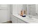 Double vanity bathroom with marble countertop and modern fixtures at 17735 W Mission Ln, Waddell, AZ 85355