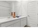 Double vanity bathroom with marble countertop and modern fixtures at 17735 W Mission Ln, Waddell, AZ 85355