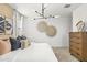 Serene bedroom featuring a large bed and wall art at 17735 W Mission Ln, Waddell, AZ 85355