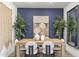 Elegant dining room with a statement wall and wood table at 17735 W Mission Ln, Waddell, AZ 85355