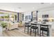 Modern kitchen with island, white cabinets, and stainless steel appliances at 17735 W Mission Ln, Waddell, AZ 85355