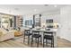 Modern kitchen with island, white cabinets, and stainless steel appliances at 17735 W Mission Ln, Waddell, AZ 85355