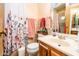 Clean bathroom with floral shower curtain and vanity at 1841 E Augusta Ave, Chandler, AZ 85249