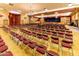 Large community hall with rows of chairs for presentations at 1841 E Augusta Ave, Chandler, AZ 85249