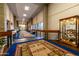 Elegant hallway with carpet runner and display cases at 1841 E Augusta Ave, Chandler, AZ 85249