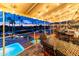 Evening view of patio with tables, chairs, and pool view at 1841 E Augusta Ave, Chandler, AZ 85249