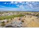 Aerial view of neighborhood amenities including a playground, sports field, and green spaces in a Primary-planned community at 1851 W Pelican Dr, Chandler, AZ 85286