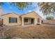 Back of home, featuring a covered patio overlooking a yard with desert landscaping at 1851 W Pelican Dr, Chandler, AZ 85286