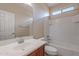 Bathroom featuring a vanity with a large mirror, a shower-tub combo, and natural light from a clerestory window at 1851 W Pelican Dr, Chandler, AZ 85286