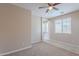 Neutral bedroom with carpet flooring, a ceiling fan, and a window allowing natural light at 1851 W Pelican Dr, Chandler, AZ 85286