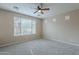 Inviting carpeted bedroom with a large window, perfect for relaxation and restful nights at 1851 W Pelican Dr, Chandler, AZ 85286