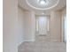 Bright foyer with tile flooring, a decorative ceiling detail, and a view of the home's entrance at 1851 W Pelican Dr, Chandler, AZ 85286