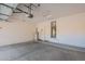 Clean, spacious garage with epoxy flooring, water heater, and ample storage space at 1851 W Pelican Dr, Chandler, AZ 85286