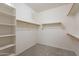 Spacious walk-in closet with built-in shelving and carpet flooring at 1851 W Pelican Dr, Chandler, AZ 85286