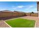 Backyard featuring artificial turf and gravel at 18819 W Cholla St, Surprise, AZ 85388