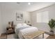 Staged bedroom featuring natural lighting and modern furnishings at 18819 W Cholla St, Surprise, AZ 85388