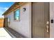 Exterior view of a modern door with a Ring doorbell and manicured landscaping at 18819 W Cholla St, Surprise, AZ 85388