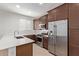 Modern kitchen featuring stainless steel appliances, stylish countertops, and ample cabinet space at 18819 W Cholla St, Surprise, AZ 85388