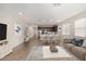 Inviting living area with a modern kitchen, dining space, and comfortable seating arrangement at 18819 W Cholla St, Surprise, AZ 85388