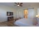 Comfortable bedroom with large TV and plenty of natural light at 20508 W Carlton Mnr Mnr, Buckeye, AZ 85396