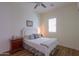 Light and airy bedroom with a double bed and nightstand at 20508 W Carlton Mnr Mnr, Buckeye, AZ 85396