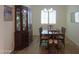 Formal dining room with a wooden table and hutch at 20508 W Carlton Mnr Mnr, Buckeye, AZ 85396