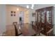 Bright dining room featuring a wood table and hutch at 20508 W Carlton Mnr Mnr, Buckeye, AZ 85396