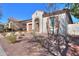 Charming one-story home with desert landscaping, arched entryway and light colored exterior at 20508 W Carlton Mnr Mnr, Buckeye, AZ 85396