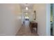 Bright hallway with tile flooring, leading to the living room and other areas of the home at 20508 W Carlton Mnr Mnr, Buckeye, AZ 85396