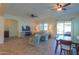 Bright and airy living room with tile floors and ceiling fans at 20508 W Carlton Mnr Mnr, Buckeye, AZ 85396