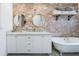 Elegant bathroom with double vanity,freestanding tub, and exposed brick feature wall at 2111 W Mulberry Dr, Phoenix, AZ 85015