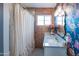 Charming bathroom with floral wallpaper and exposed brick at 2111 W Mulberry Dr, Phoenix, AZ 85015