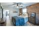 Cozy bedroom with a metal bed frame and exposed brick wall at 2111 W Mulberry Dr, Phoenix, AZ 85015