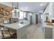 Modern kitchen with white cabinets, marble countertops, and stainless steel appliances at 2111 W Mulberry Dr, Phoenix, AZ 85015