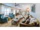 Spacious living room showcasing a brown leather sofa and teal armchairs at 2111 W Mulberry Dr, Phoenix, AZ 85015