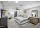 Spacious main bedroom with king bed, rustic accents, and an ensuite bathroom at 2111 W Mulberry Dr, Phoenix, AZ 85015