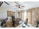 Home office with built-in desk and exposed brick wall at 2111 W Mulberry Dr, Phoenix, AZ 85015