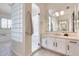 Spa-like bathroom with a glass block shower and large vanity at 22432 N 48Th St, Phoenix, AZ 85054