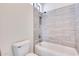 Clean bathroom with a shower/tub combo and modern tile at 22432 N 48Th St, Phoenix, AZ 85054