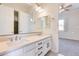 Double vanity bathroom with white cabinets and quartz countertop at 22432 N 48Th St, Phoenix, AZ 85054