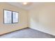 Simple bedroom with grey carpet and a window at 22432 N 48Th St, Phoenix, AZ 85054